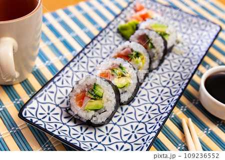 Japanese roll futomaki with soy sauces Japanese roll futomaki with soy sauces 109236552