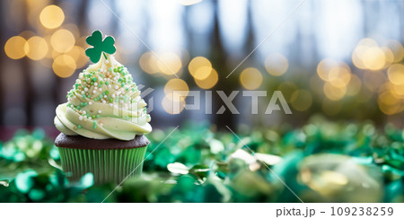 St Patrick's day concept - cupcake with shamrock topper 109238259