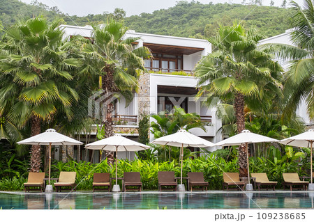 Modern luxury touristic resort hotel with swimming pool. Modern luxury touristic resort hotel with swimming pool. 109238685