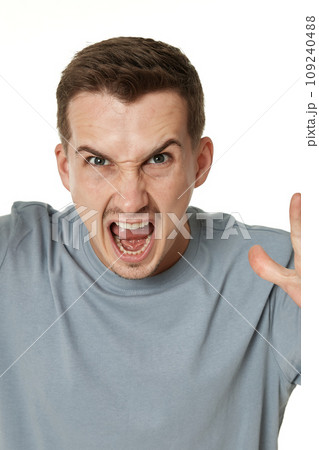 annoyed angry bearded man shouting on white studio background annoyed angry bearded man shouting on white studio background 109240488