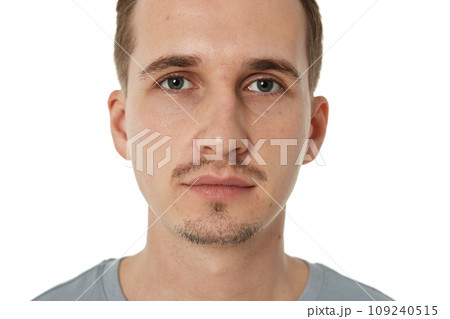 portrait of young calm man on white background 109240515