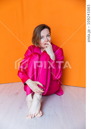 Beautiful fashionable woman in crimson silk pajamas 109243865