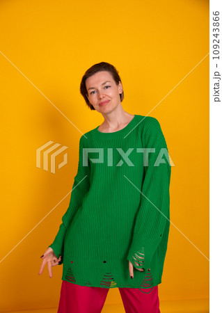 Beautiful woman in green autumn sweater 109243866