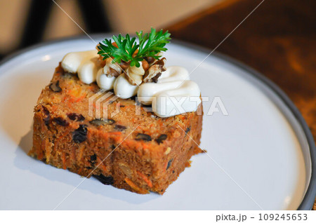 carrot cake with pecan and cream topping , pecan cake 109245653