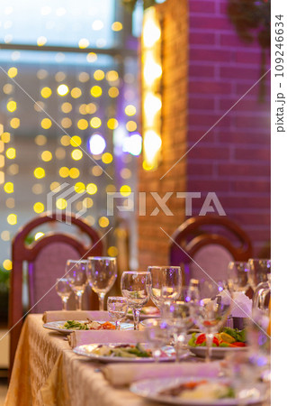 Served festive table with snacks, glasses, glasses, cutlery and napkins for a banquet 109246634