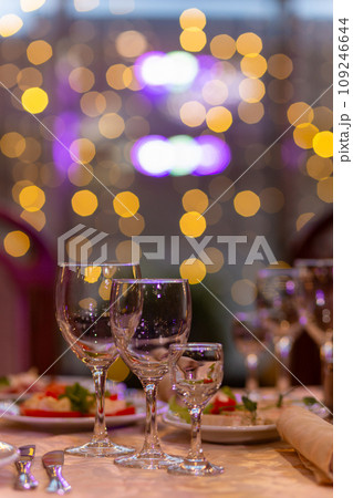 Served festive table with snacks, glasses, glasses, cutlery and napkins for a banquet 109246644