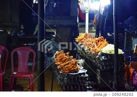 Street food and cuisine made with different types of Ocean fishes, crabs, octopus etc. at  the sea beach side of Puri seashore , Odisha, India, Asia 12.02.2020. 109248202