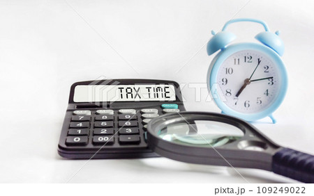 Tax Time word on calculator. Business and tax concept. Time to pay tax in year. 109249022
