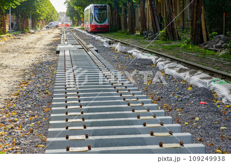 Laying new tram rails on new concrete sleepers with pads that reduces vibration and noise emission Laying new tram rails on new concrete sleepers with pads that reduces vibration and noise emission 109249938
