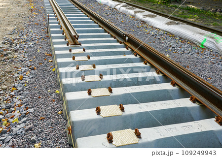 Laying new tram rails on new concrete sleepers with pads that reduces vibration and noise emission 109249943