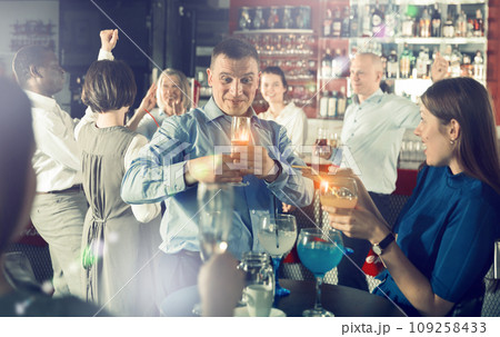 Businessman having fun at corporate party 109258433
