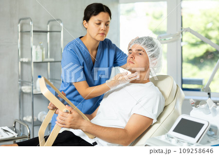 Client gazed into mirror Client gazed into mirror 109258646