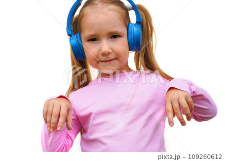 Carefree attractive girl with dark long hairstyle, listening music in headphones standing over white background Carefree attractive girl with dark long hairstyle, listening music in headphones standing over white background 109260612