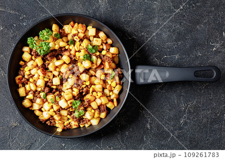 Beef Hash with roasted corn, garlic and parsley 109261783
