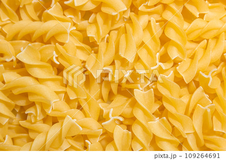 Uncooked Fusilli Pasta Background Uncooked Fusilli Pasta Background 109264691