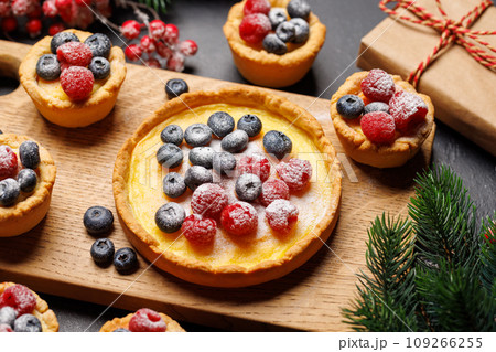 Christmas cupcakes adorned with berries 109266255