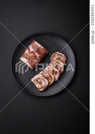 Delicious meatloaf with lard, salt, spices and herbs cut into slices 109266941