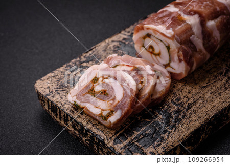 Delicious meatloaf with lard, salt, spices and herbs cut into slices Delicious meatloaf with lard, salt, spices and herbs cut into slices 109266954