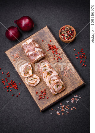 Delicious meatloaf with lard, salt, spices and herbs cut into slices 109266976
