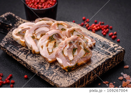 Delicious meatloaf with lard, salt, spices and herbs cut into slices 109267004