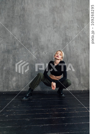 Beautiful slender blonde woman in military clothes Beautiful slender blonde woman in military clothes 109268295