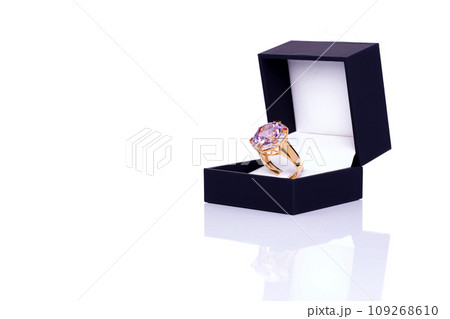 Amethyst, ruby and white zircon Jewel or gems ring in dark blue jewel box. Collection of natural gemstones accessories. Studio shot Amethyst, ruby and white zircon Jewel or gems ring in dark blue jewel box. Collection of natural gemstones accessories. Studio shot 109268610