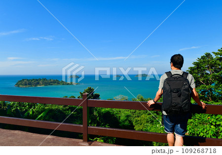 Tourists standing on the viewpoint of Chang island ,the famouse island of Thailand Tourists standing on the viewpoint of Chang island ,the famouse island of Thailand 109268718