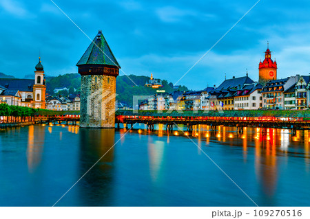 The famous "Chapel Bridge"wooden footbridge spanning across Reuss river The famous "Chapel Bridge"wooden footbridge spanning across Reuss river 109270516