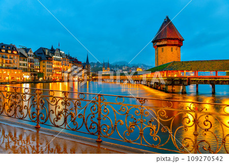 Beautiful historic city of Lucerne with famous Chapel Bridge and Water Tower at twilight time , Switzerland 109270542