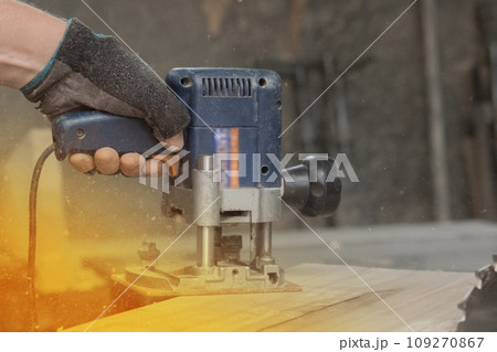 Hand male worker industry grinder tool object woodworking board plank close-up sunlight Hand male worker industry grinder tool object woodworking board plank close-up sunlight 109270867