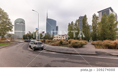Panorama showing skyscrapers and towers from park with green lawn timelapse in Milan 109274088