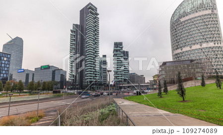 Panorama showing skyscrapers and biblioteca from park with green lawn timelapse in Milan 109274089