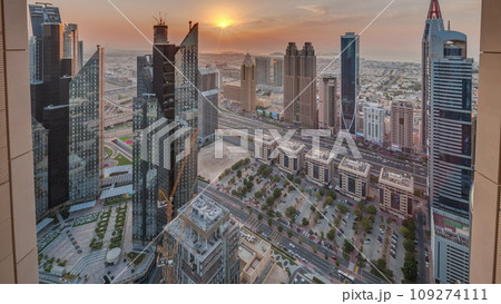 High-rise buildings on Sheikh Zayed Road in Dubai aerial timelapse during sunset, UAE. High-rise buildings on Sheikh Zayed Road in Dubai aerial timelapse during sunset, UAE. 109274111