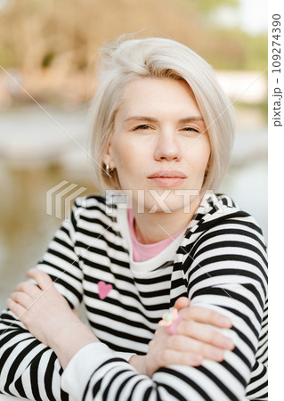 Photo of young attractive girl happy positive smile rest relax summer season park outdoors. 109274390