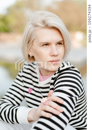 Photo of young attractive girl happy positive smile rest relax summer season park outdoors. Photo of young attractive girl happy positive smile rest relax summer season park outdoors. 109274394