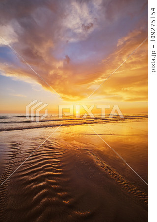 Atlantic ocean sunset with surging waves at Fonte da Telha beach, Costa da Caparica, Portugal Atlantic ocean sunset with surging waves at Fonte da Telha beach, Costa da Caparica, Portugal 109275154