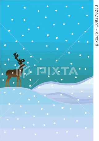 A reindeer standing alone on the snowed hill with the light blue sky background and the falling snow. 109276233