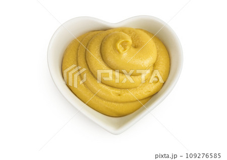 Mustard sauce in ceramic bowl isolated on white background. Top view. Flat lay 109276585