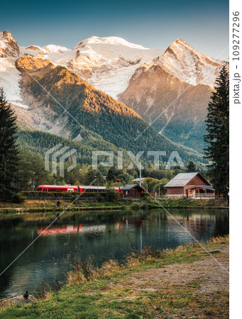 Lac des Gaillands with Mont Blanc massif and train at station in the sunset at Chamonix 109277296