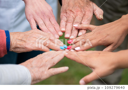 Concept of family, aging society or teamwork, hands showing unity with putting hands together 109279640