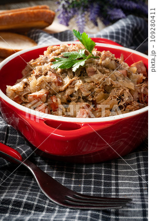 Bigos - sauerkraut stewed with meat, dried mushrooms and sausage. 109280411