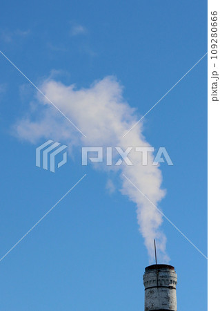 Vertical photo of a smoking chimney against the sky. Vertical photo of a smoking chimney against the sky. 109280666