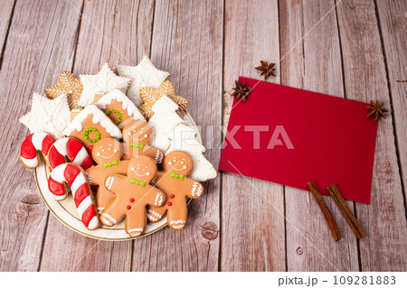 Christmas bake tools on flour and rustic wooden background, flat lay.Copy space Christmas bake tools on flour and rustic wooden background, flat lay.Copy space 109281883