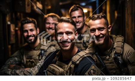 Smiling soldiers look at camera, happy faces of men in modern uniform at night. Portrait of group of military male in dark place. Concept of war, US army, young people 109285647