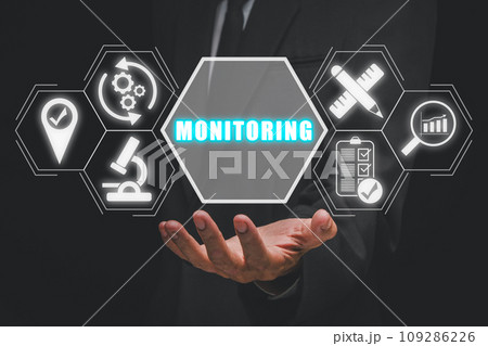 Monitoring concept, Businessman hand holding monitoring icon on virtual screen. 109286226