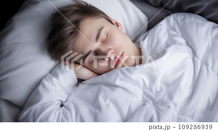 Young Caucasian man sleeps under warm plaid on soft bed at home closeup Young Caucasian man sleeps under warm plaid on soft bed at home closeup 109286939