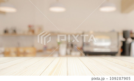Empty wood table top with cafe restaurant interior blur background Empty wood table top with cafe restaurant interior blur background 109287905