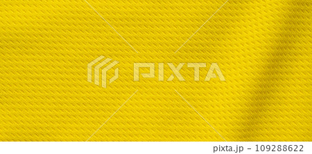 Yellow sports clothing fabric football shirt jersey texture close up 109288622