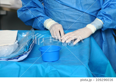 Preparation for the operation. Modern surgery. The work of doctors in the operating room. Close-up of the hands. Preparation for the operation. Modern surgery. The work of doctors in the operating room. Close-up of the hands. 109296016