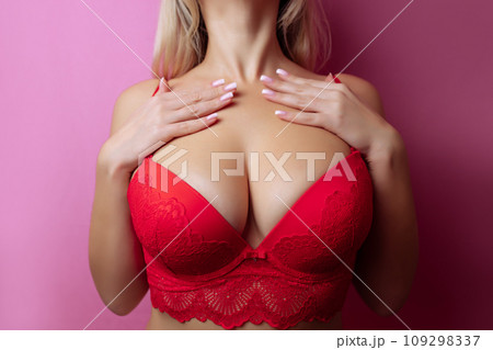 Close-up of sexy breasts in bra. Woman's breasts or big natural boobs in lingerie. Plastic surgery Close-up of sexy breasts in bra. Woman's breasts or big natural boobs in lingerie. Plastic surgery 109298337